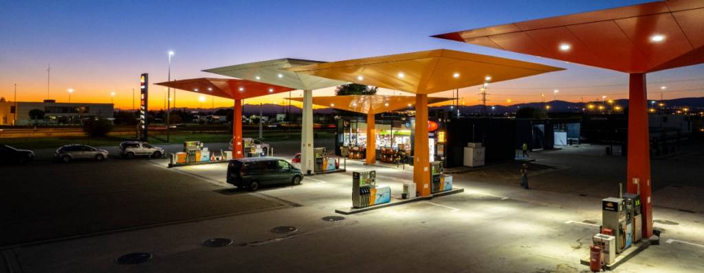 View of a Repsol service station at night