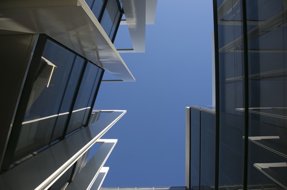 Image looking up at the Repsol Campus structure and the sky in the background