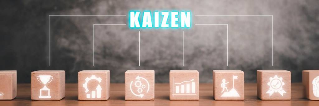 wooden cubes with the word kaizen