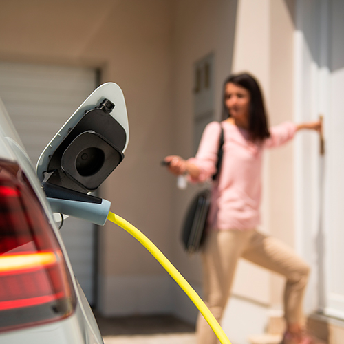 Electric car charger plugged into a private home