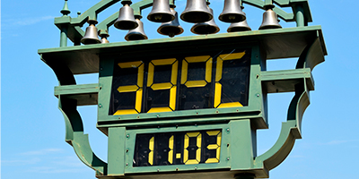 A street thermometer that displays time and temperature