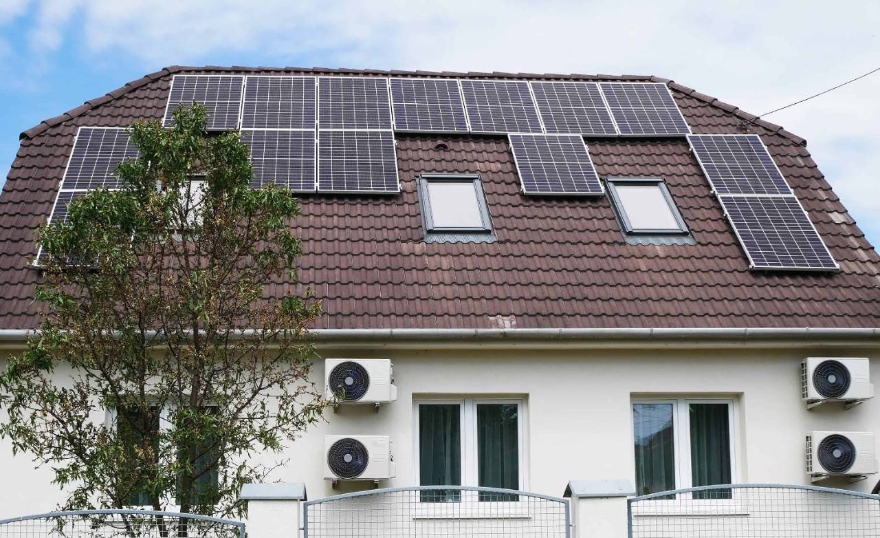 house with aerothermal energy and solar panels
