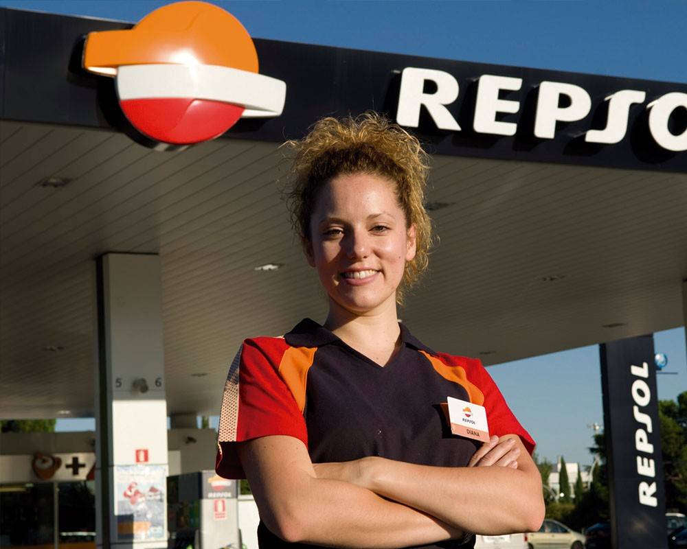 Repsol employee at a fuel pump