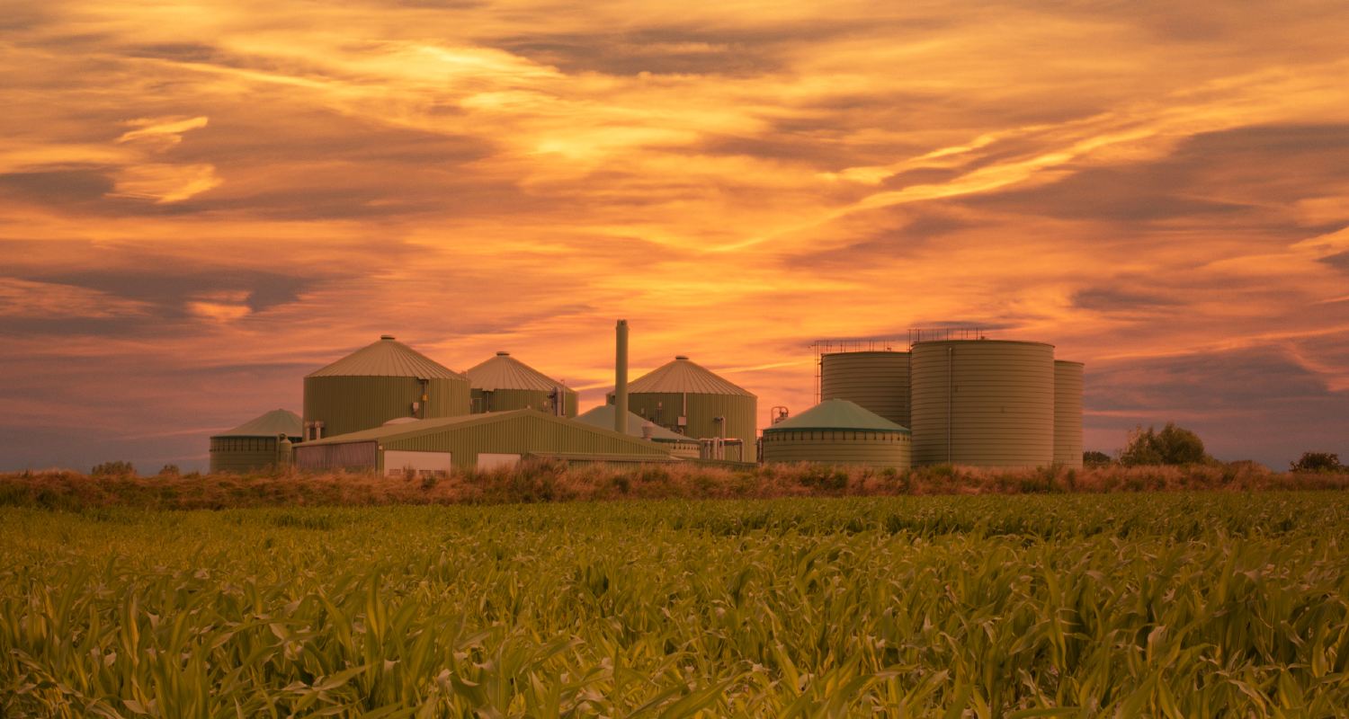 view of a biogas plant at sunset