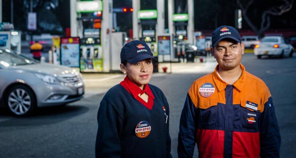 two Repsol service station employees