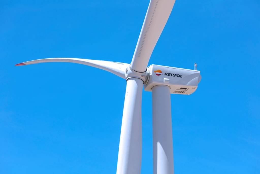 View of a wind turbine with Repsol logo