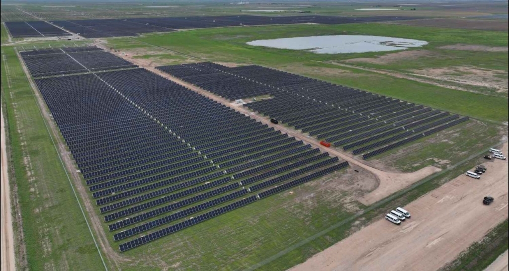 View of solar panels in a field